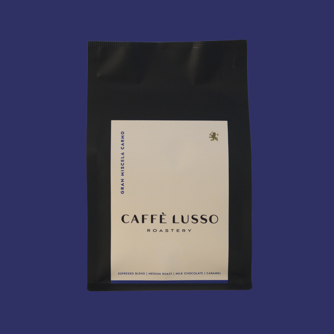 Caffè Lusso coffee bag of Gran Miscela Carmo on a blue background