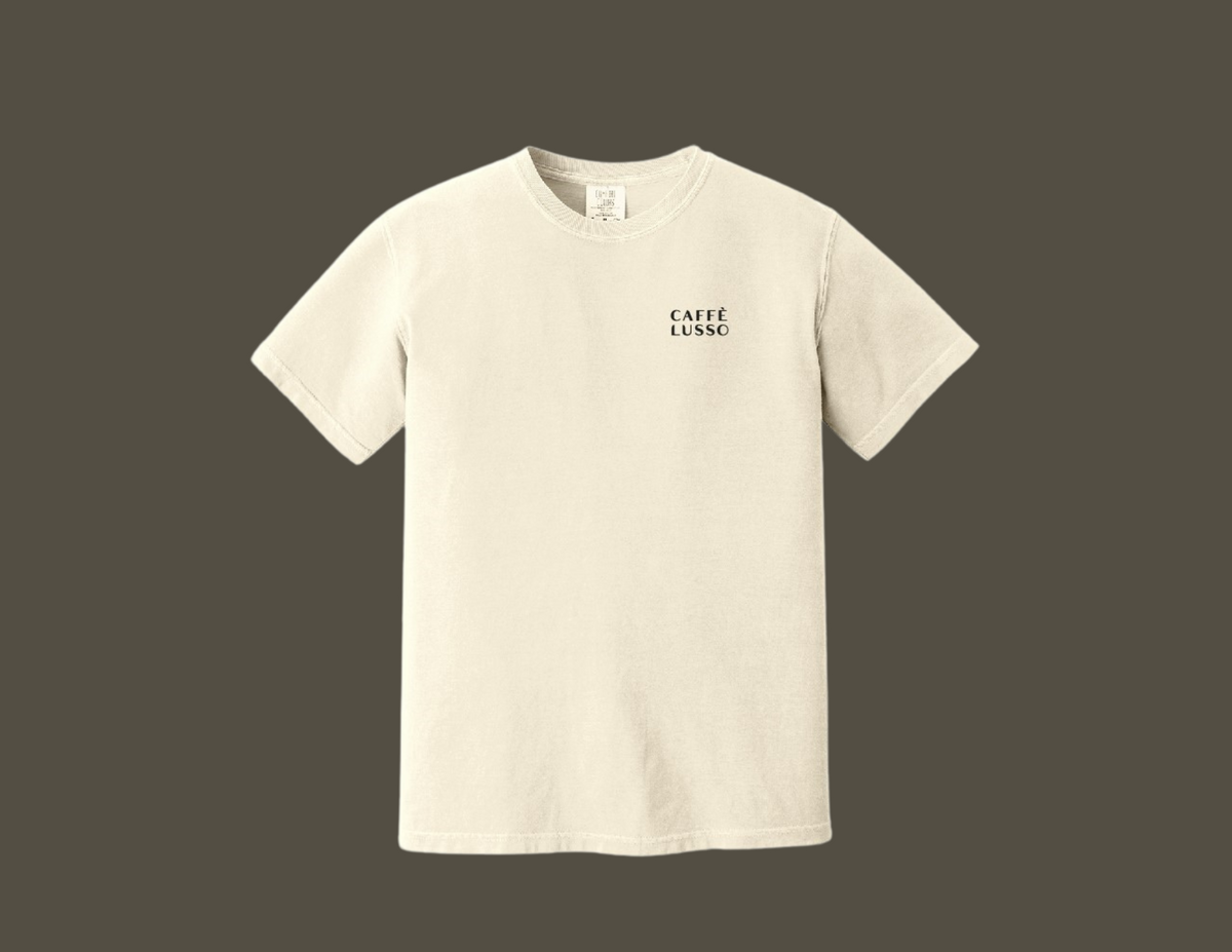 The front of a white heavy weight cotton to shirt with a black logo of Caffe Lusso on the upper left chest