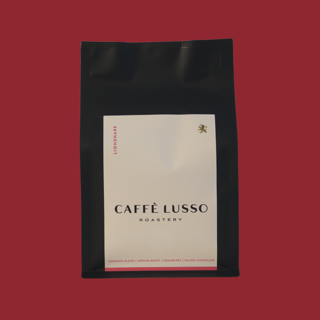 Caffè Lusso coffee bag of LIonshare on a red background