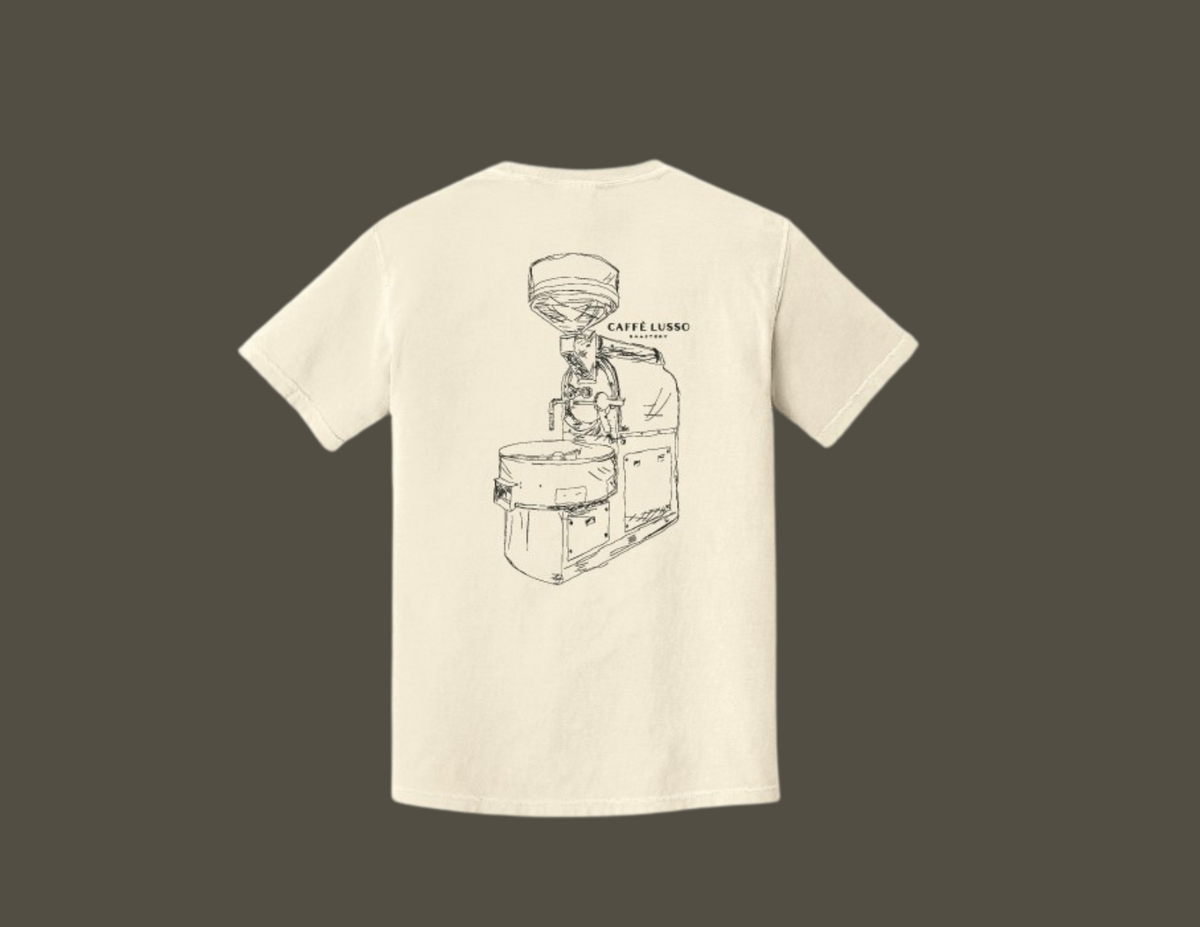  a white, heavy weight ring spun cotton tee with a hand sketched drawing of a coffee roasting machine on the back.
