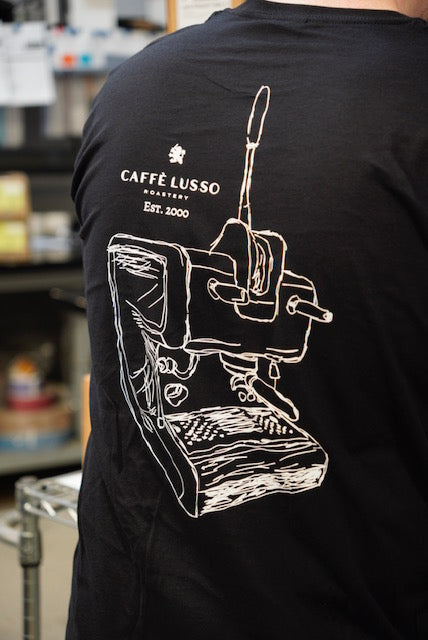 Black t-shirt with white sketch of a single group lever machine and 'Caffè Lusso' branding.