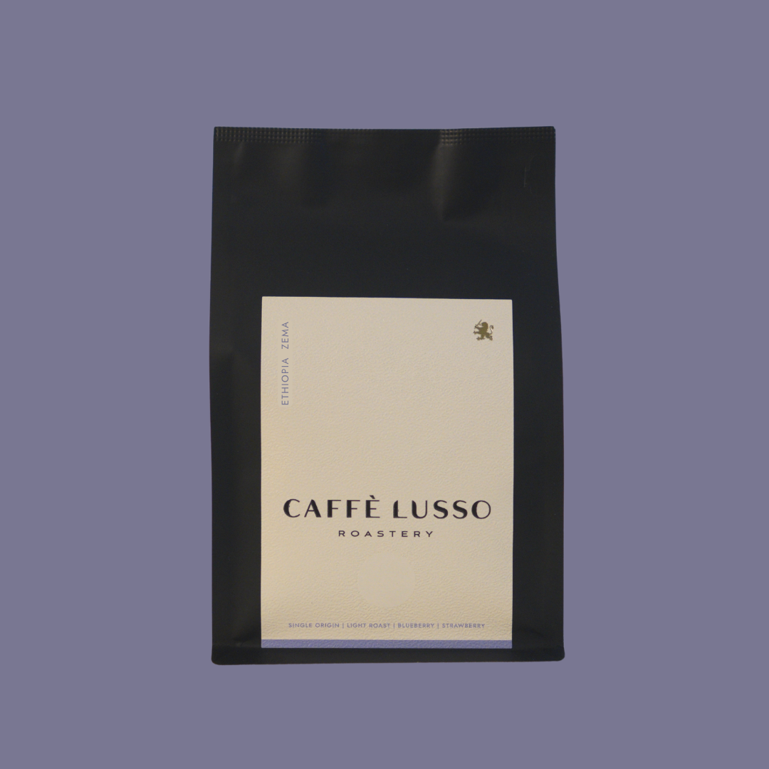 Caffè Lusso coffee bag of Ethiopia Zema on a purple background