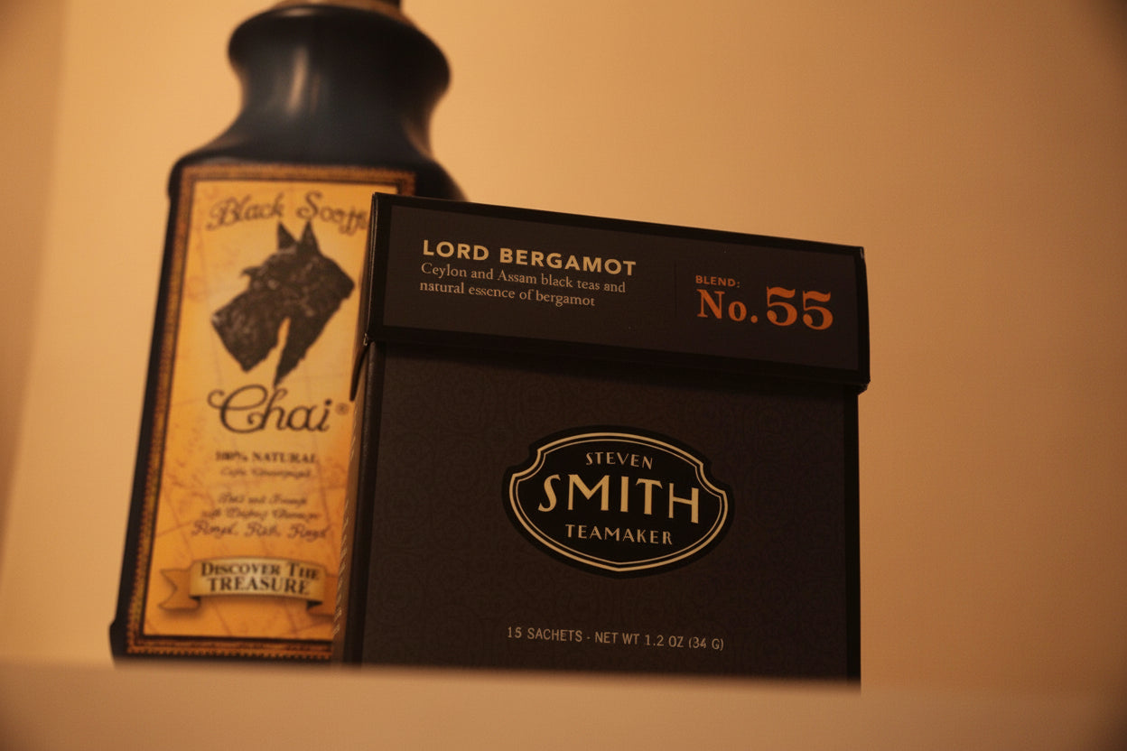 Two product packages on a beige background, one labeled 'Black Scottie Chai' and the other 'Smith Teamaker'.